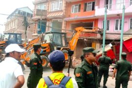 Kathmandu Metropolis drives a dozer to the house in Gaushala Chowk