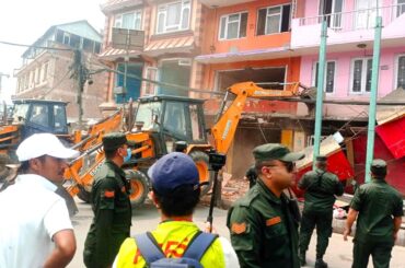 Kathmandu Metropolis drives a dozer to the house in Gaushala Chowk